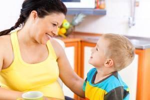 mom and child smiling at eachother