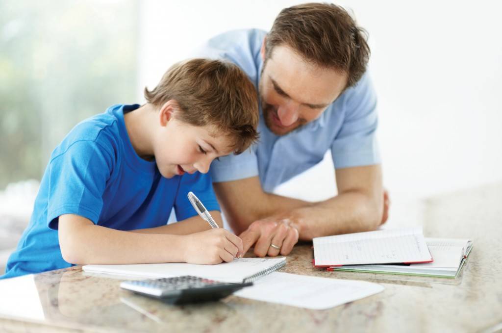Dad helping son with homework