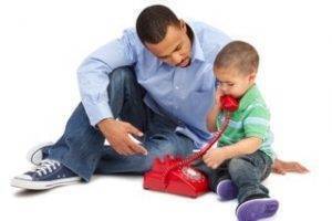Dad and son talking on the phone