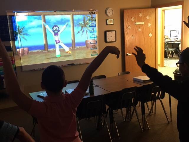 Students taking a brain break and dancing in classroom