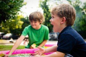 two young kids playing outside
