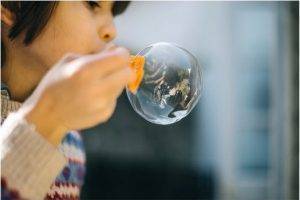 Child building speech and language skills through play
