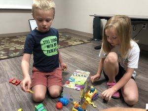 students playing with toys