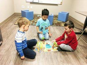 23405662_560174191041215_6714671016748303_o-300×225 student playing a board game