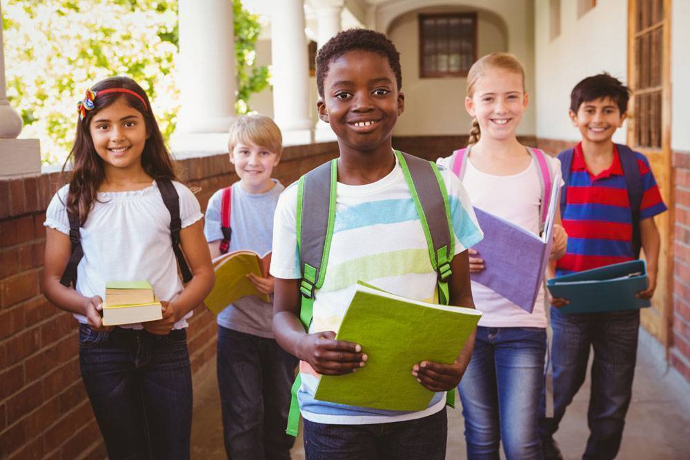 group of student walking in school hallway