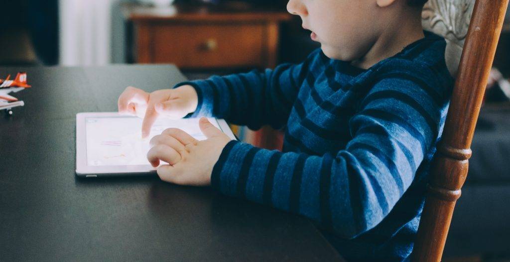 Child looking at tablet