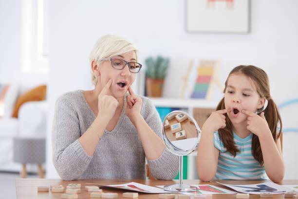 Adult and child working on articulation techniques
