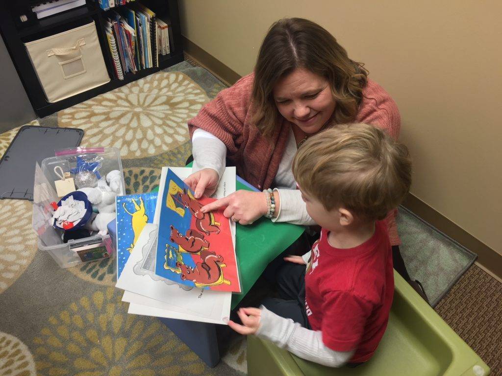 Teacher working with student on phonological awareness