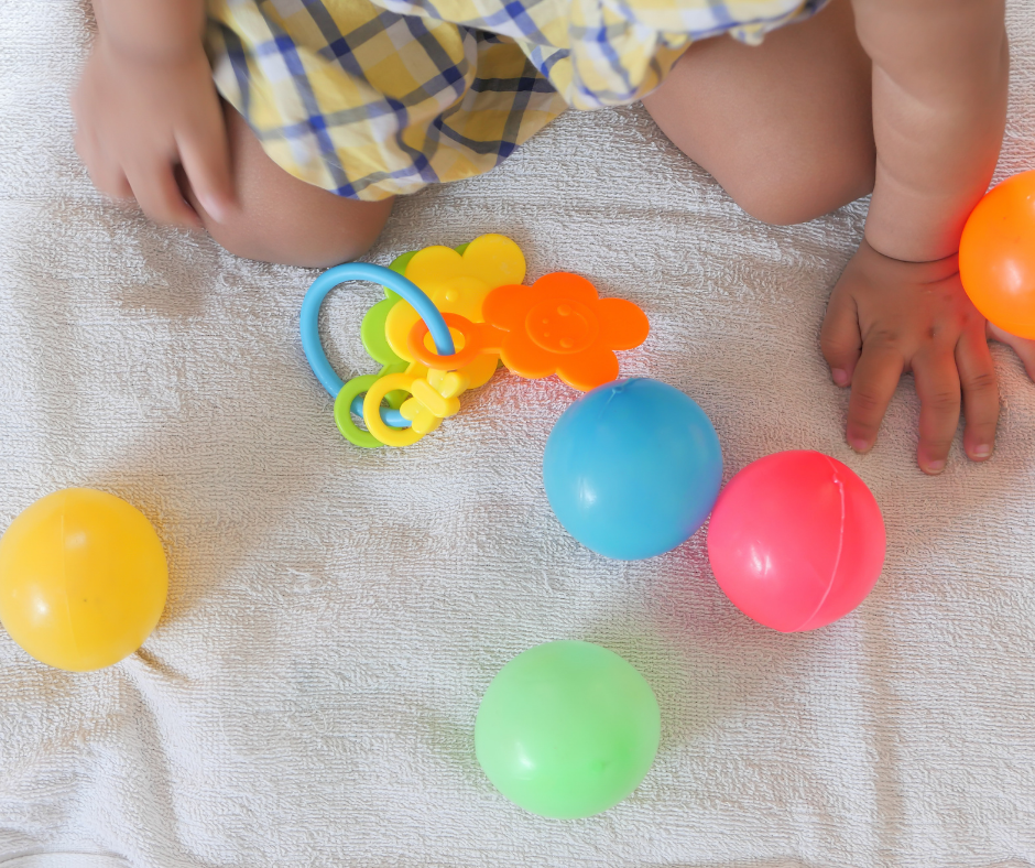 Young toddler playing with toys