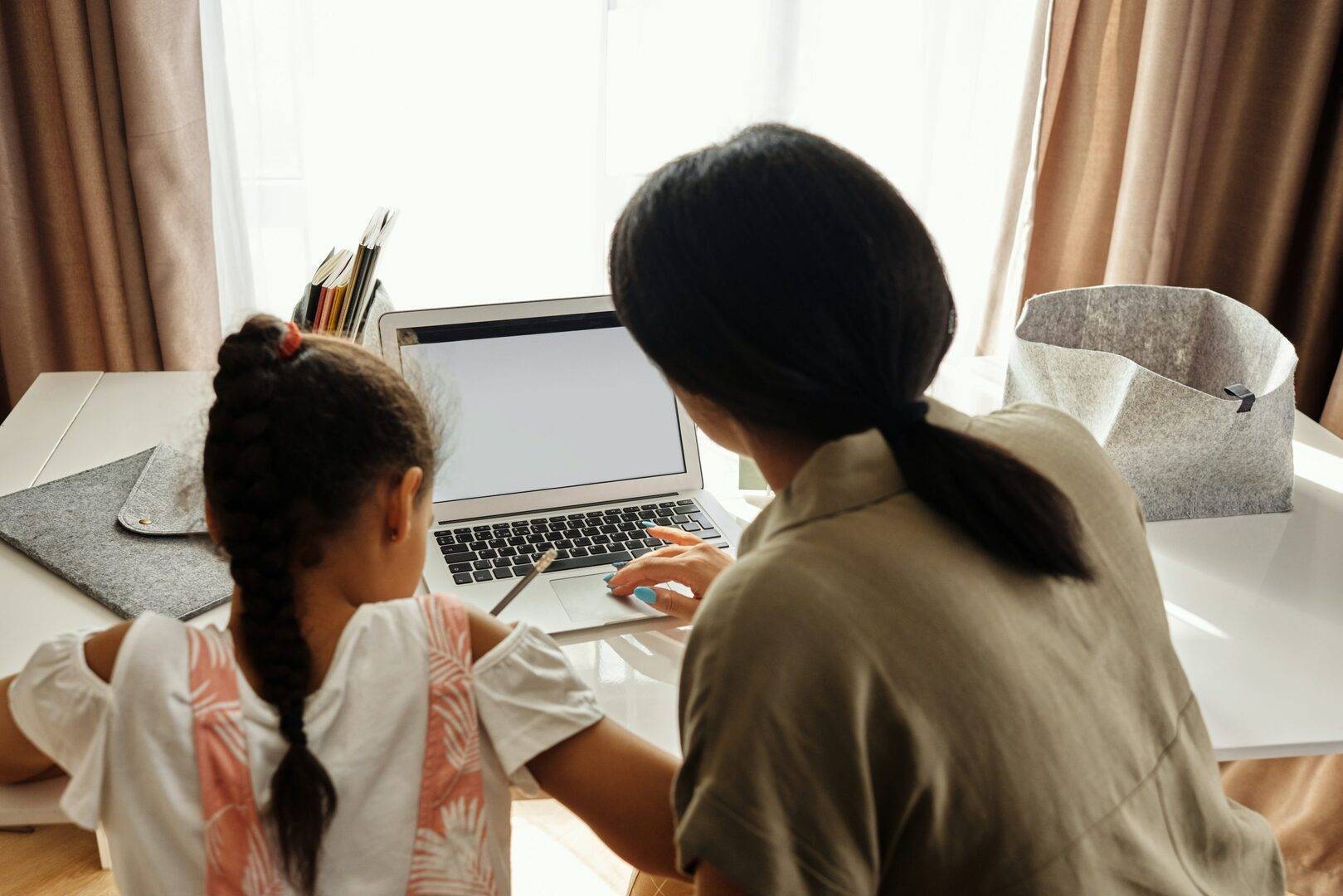 PlanDoReview option 6 child and adult working on laptop