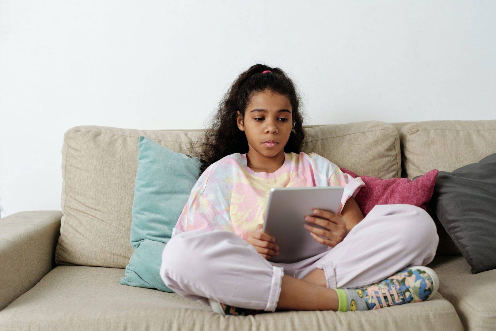 Child reading on a tablet