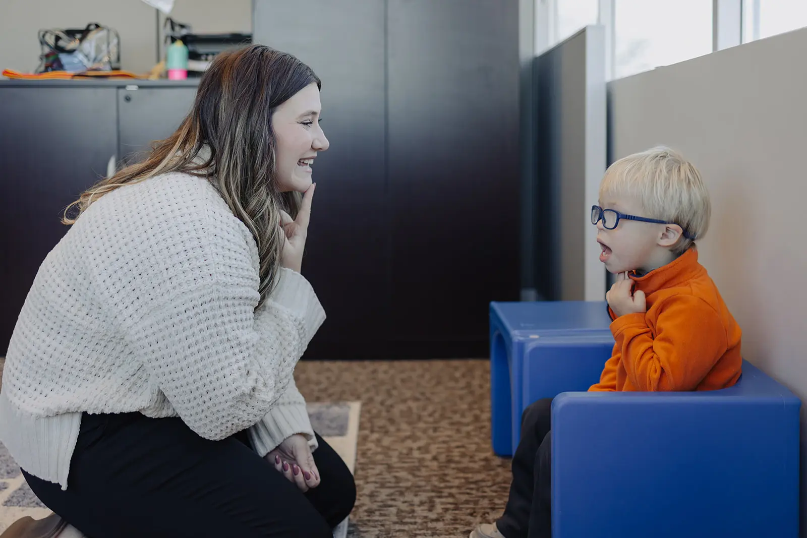 speech-language pathologist working with child.
