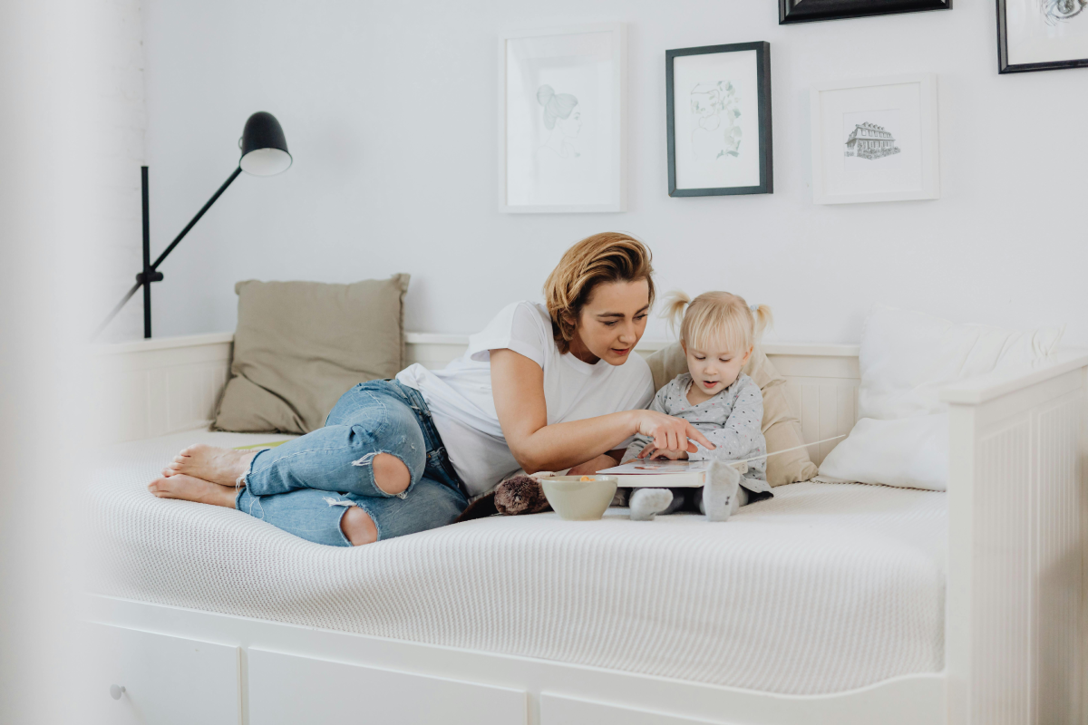 mother and child read on couch