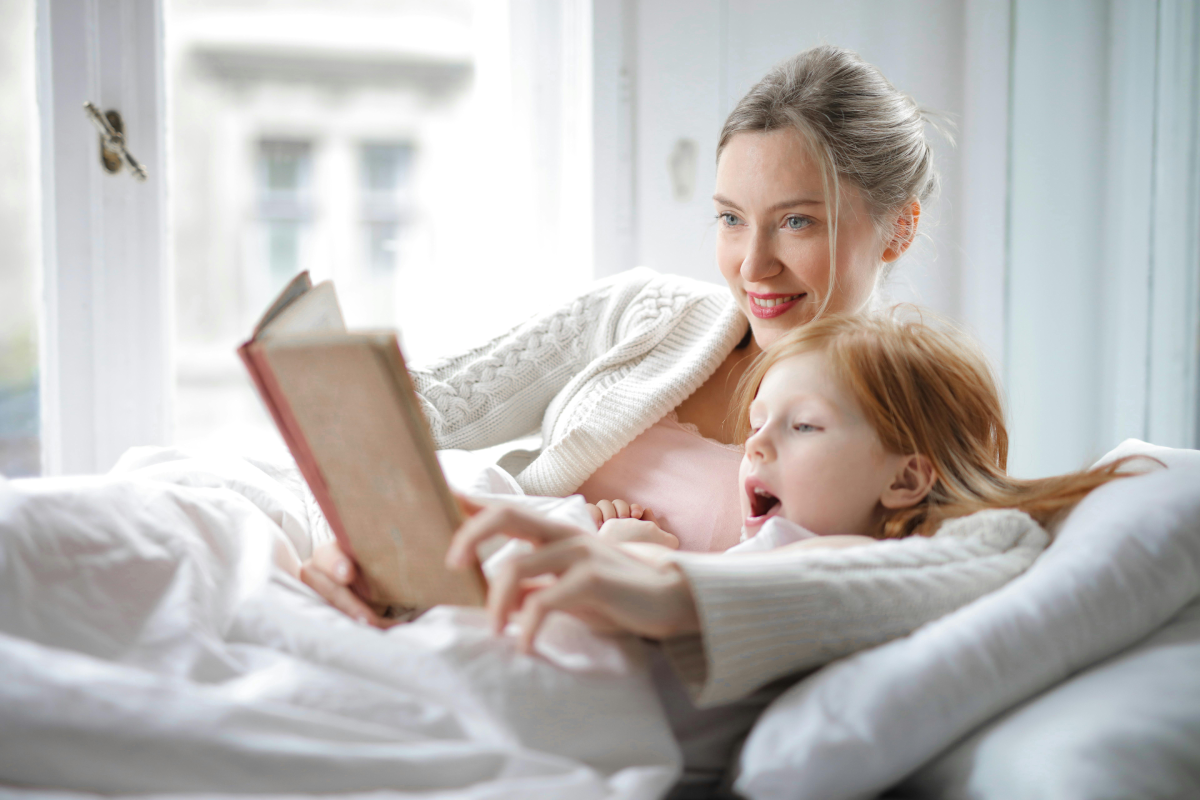 Mom and Daughter Read mother helps daughter read
